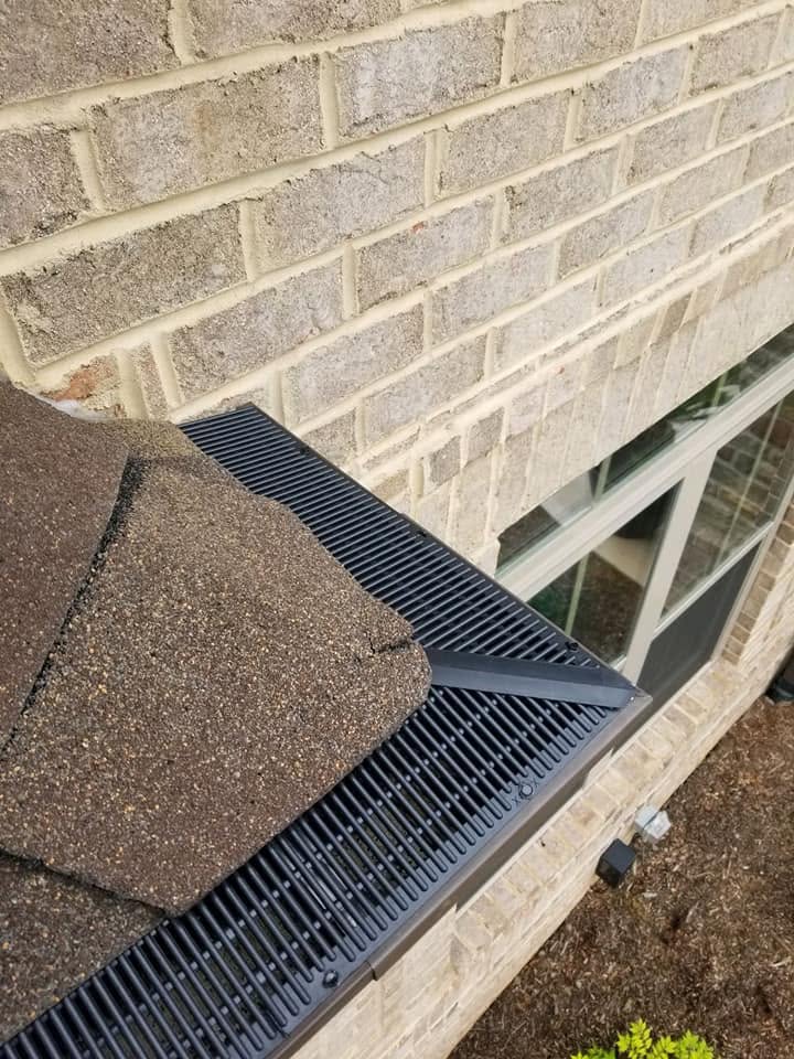Hickory Gutter Pros crew installing RainDrop guards